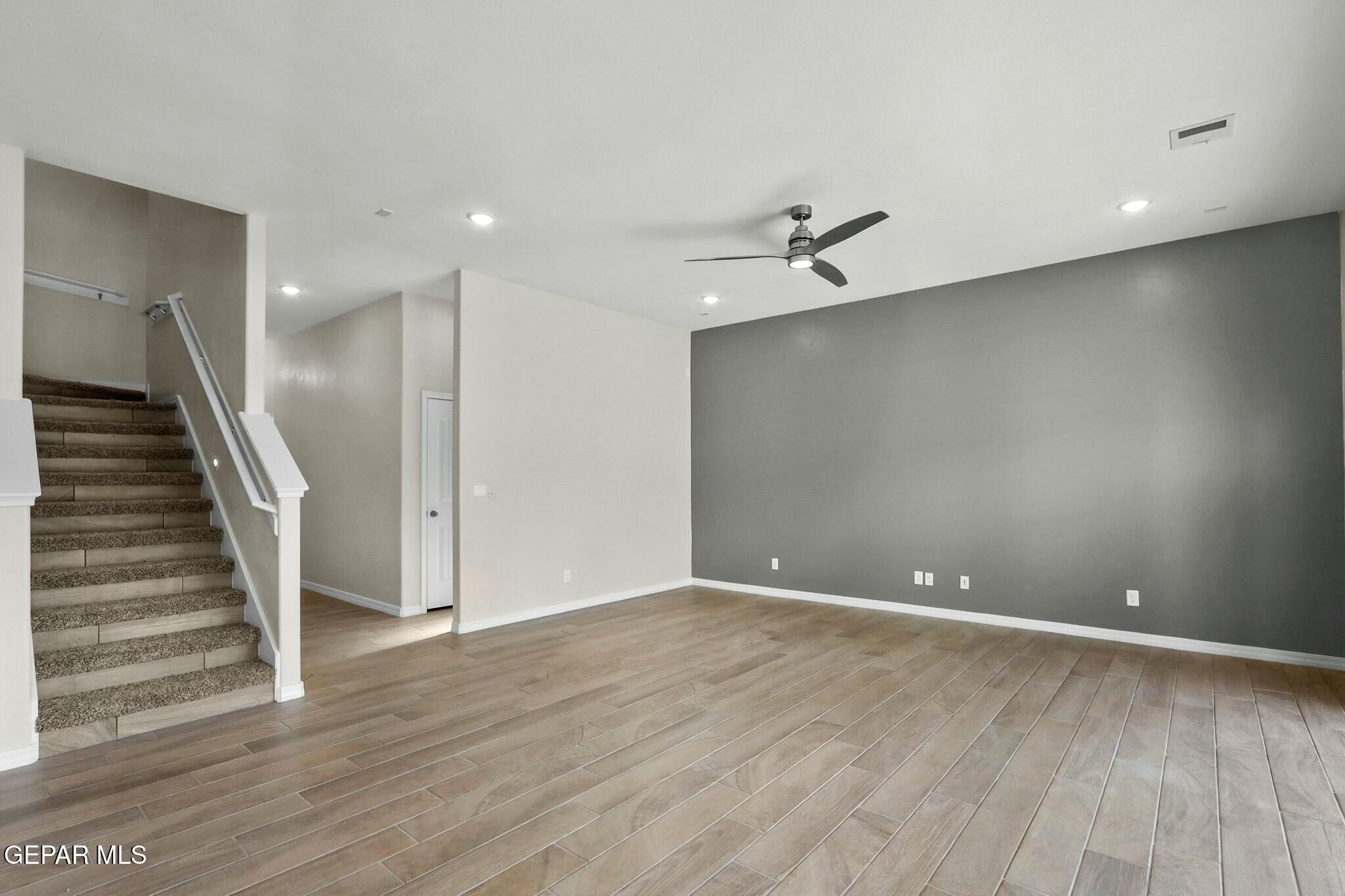 3872 Object Place El Paso, TX 79938 - Photo 9 of 33 wooden floor in an empty room with a window