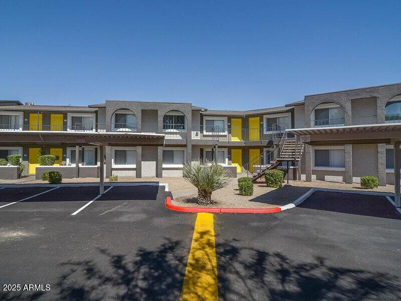 17805 North 40th Street, Unit 2 Phoenix, AZ 85032 - Photo 1 of 13 a front view of a building with sitting area