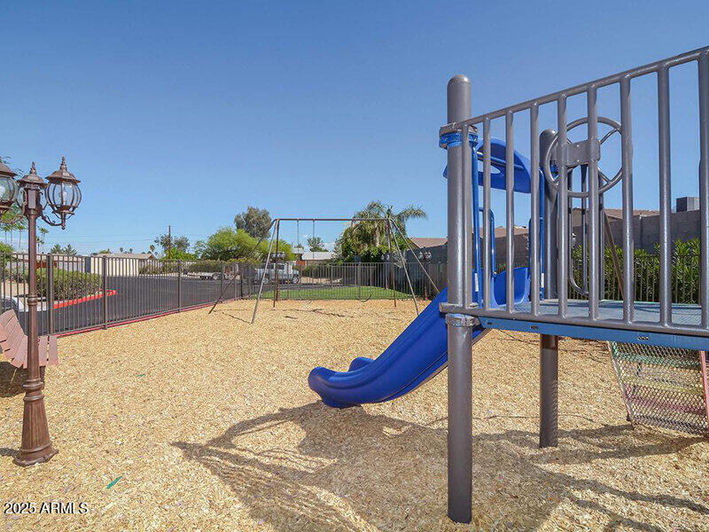 17805 North 40th Street, Unit 2 Phoenix, AZ 85032 - Photo 13 of 13 a view of a swimming pool with a lounge chair