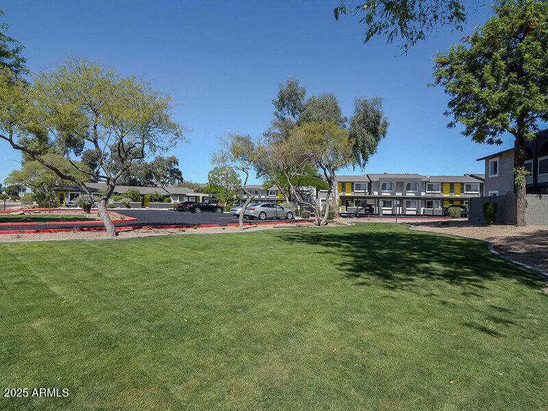 17805 North 40th Street, Unit 2 Phoenix, AZ 85032 - Photo 2 of 13 a view of yard with green space and trees