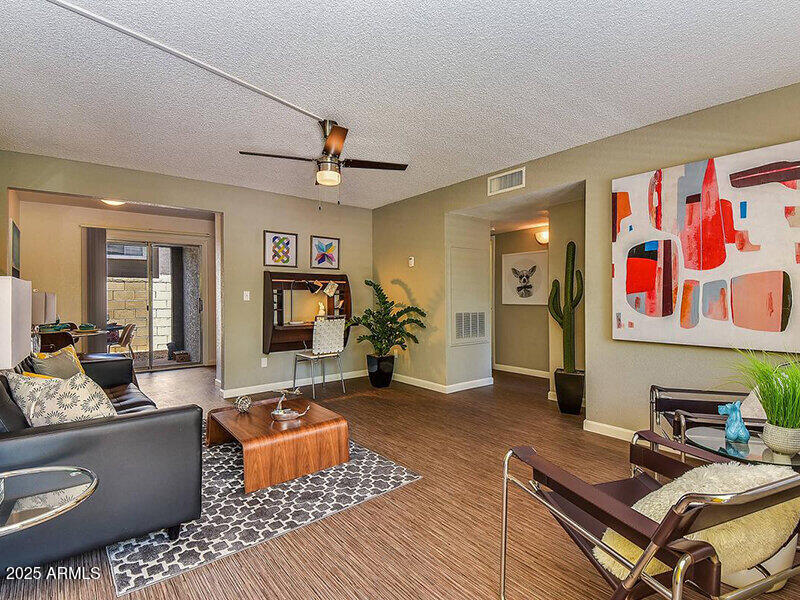 17805 North 40th Street, Unit 2 Phoenix, AZ 85032 - Photo 3 of 13 a living room with furniture and wooden floor