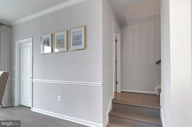a view of an entryway with wooden floor