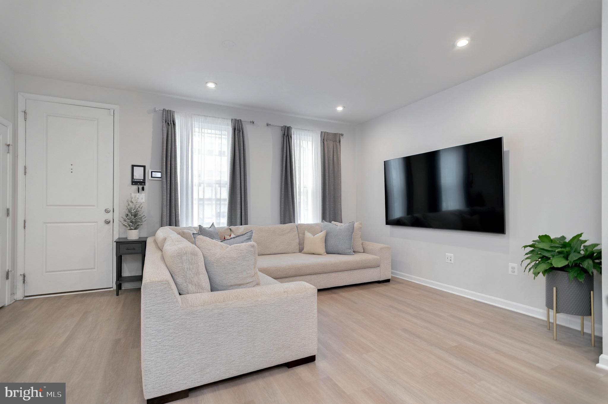18245 Summit Pointe Drive Triangle, VA 22172 - Photo 2 of 45 a living room with furniture and a flat screen tv
