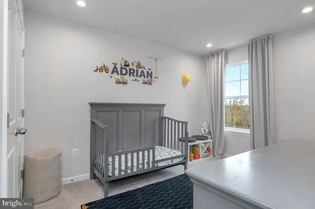 a bedroom with furniture and window