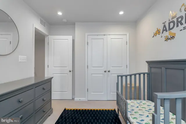 a view of a utility room with cabinet