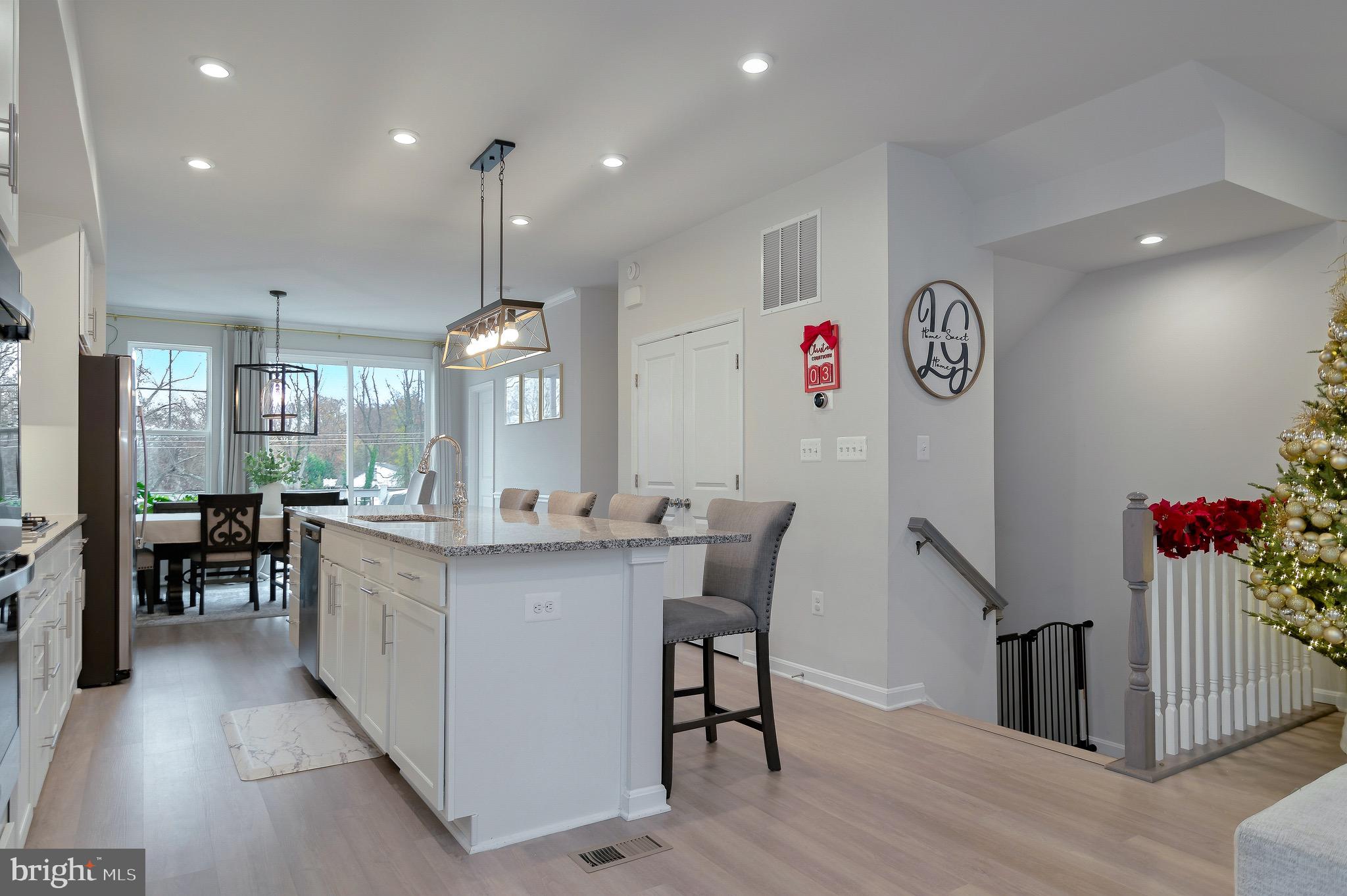 18245 Summit Pointe Drive Triangle, VA 22172 - Photo 3 of 45 a view of a dining room with furniture window and wooden floor