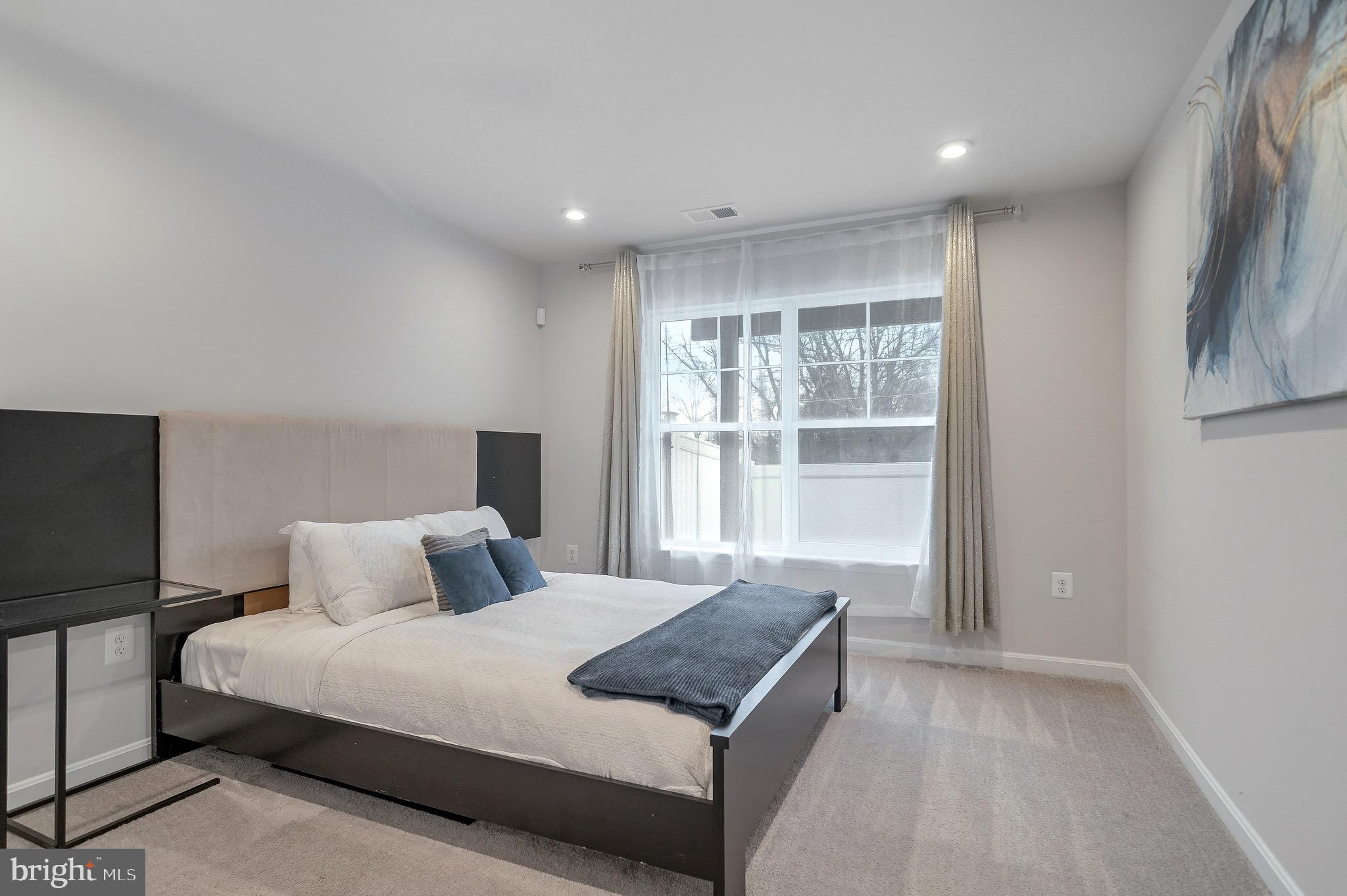 18245 Summit Pointe Drive Triangle, VA 22172 - Photo 36 of 45 a bedroom with a large bed and a window