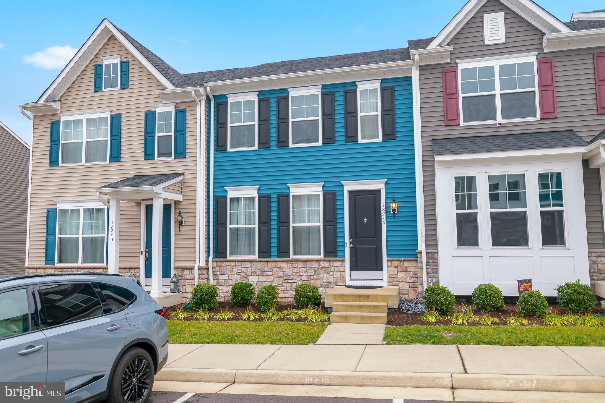 18245 Summit Pointe Drive Triangle, VA 22172 - Photo 45 of 45 a front view of a house with a yard and garage