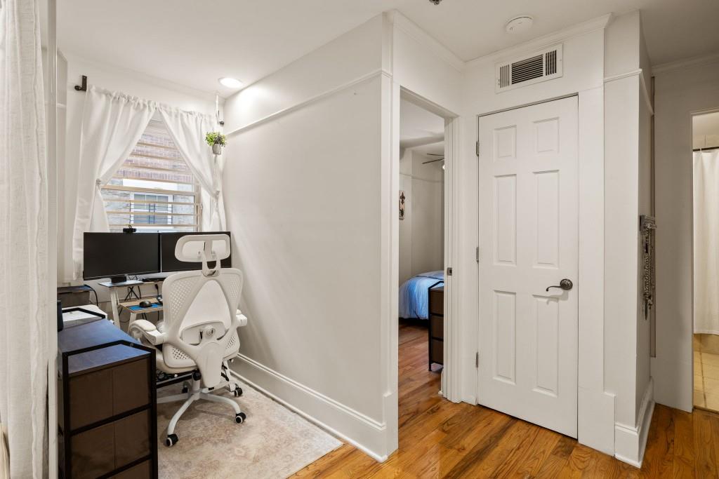 259 14th Street Northeast, Unit B103 Atlanta, GA 30309 - Photo 11 of 33 a view of a workspace with furniture and a window