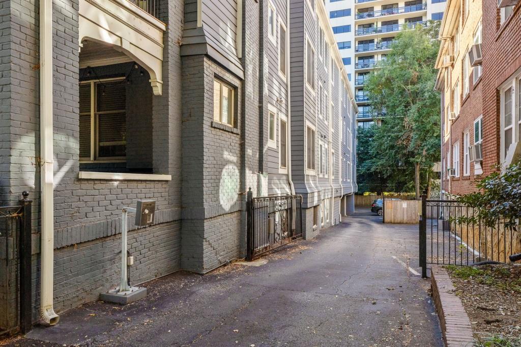 259 14th Street Northeast, Unit B103 Atlanta, GA 30309 - Photo 18 of 33 a view of a brick house with many windows