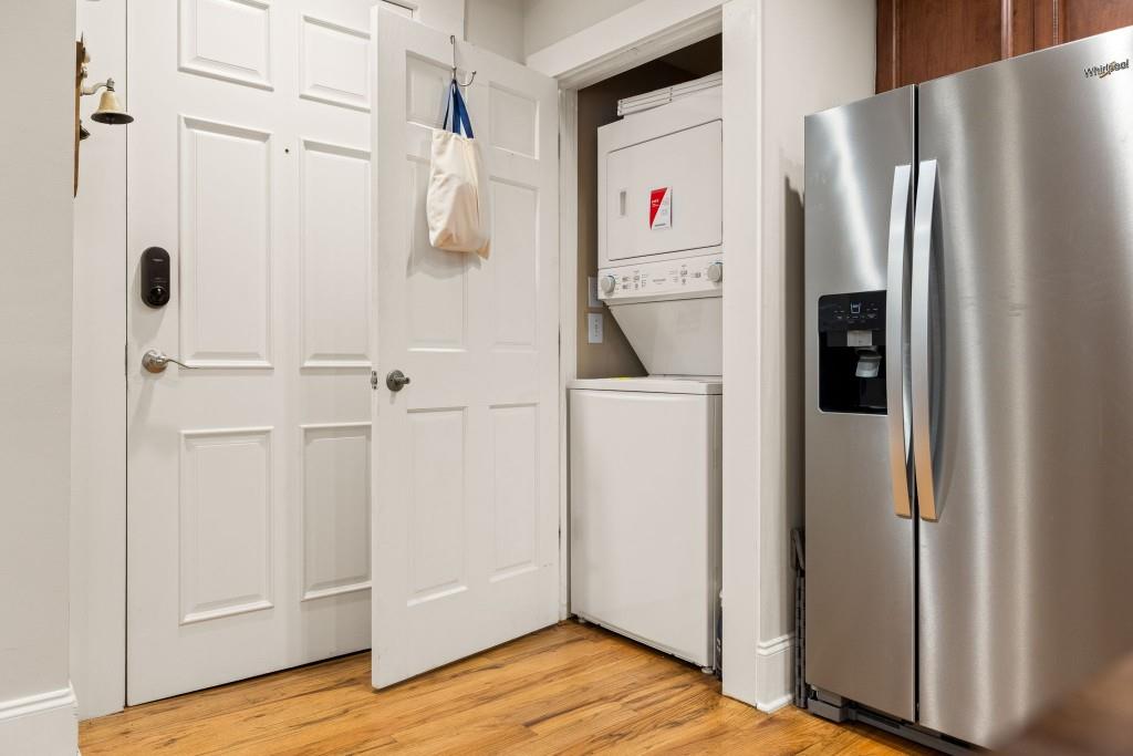 259 14th Street Northeast, Unit B103 Atlanta, GA 30309 - Photo 8 of 33 a view of kitchen with refrigerator and wooden floor