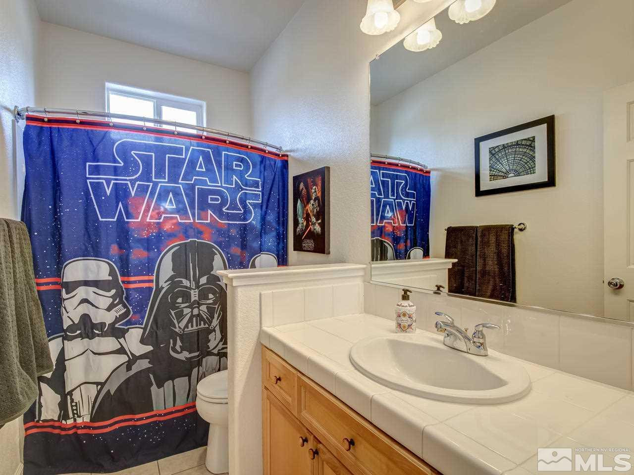 1723 Cavern Drive Reno, NV 89521 - Photo 20 of 25 a bathroom with double vanity sinks and a mirror