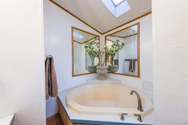 a bathroom with a tub and shower