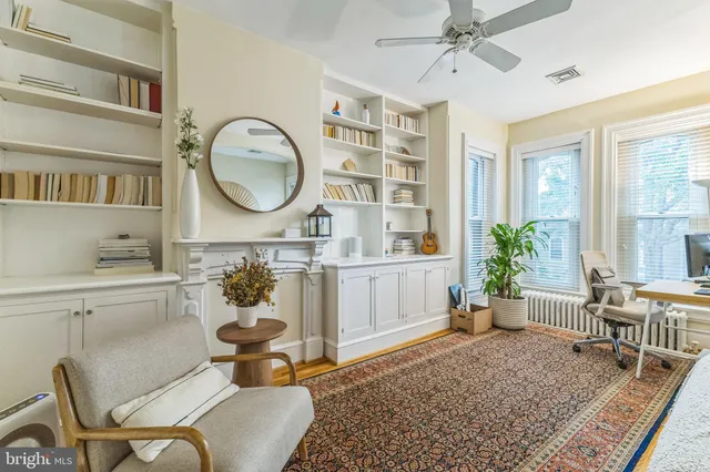 a living room with furniture and a rug