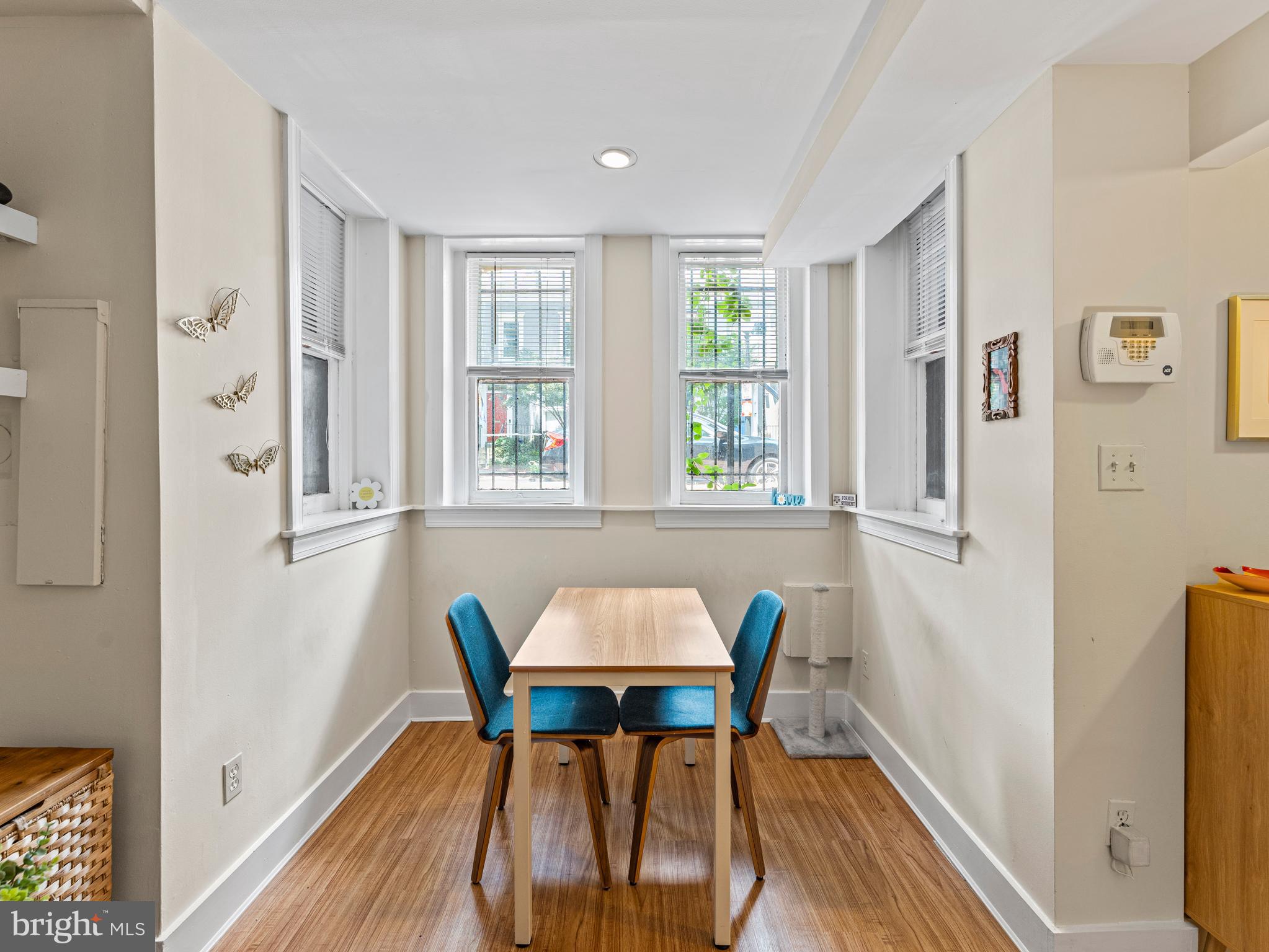 1414 Swann Street Northwest Washington, DC 20009 - Photo 21 of 38 a view of a dining room with furniture and a window