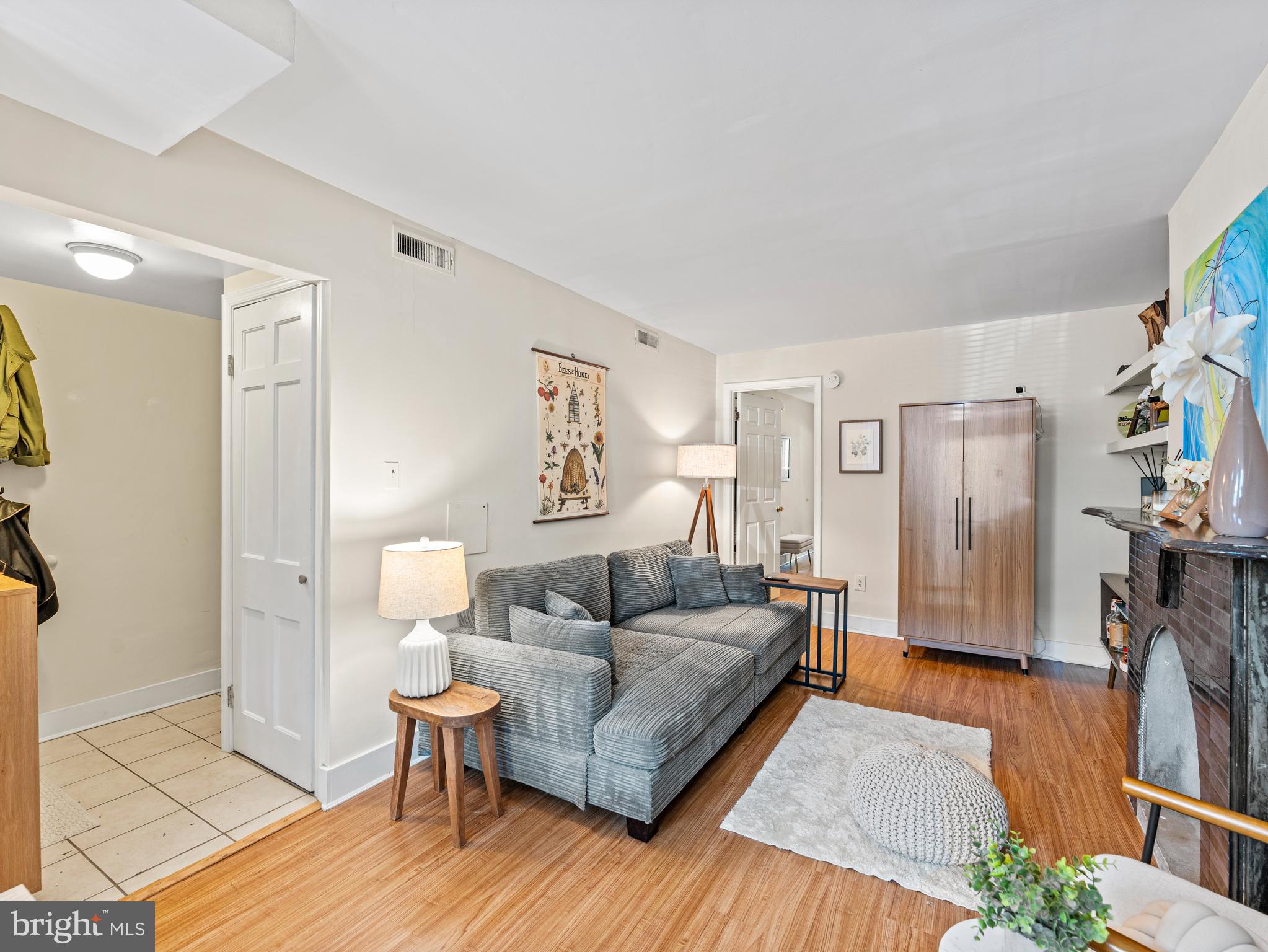 1414 Swann Street Northwest Washington, DC 20009 - Photo 23 of 38 a living room with furniture and a wooden floor
