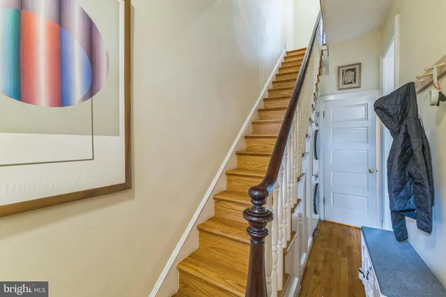 a view of entryway with stairs and wooden floor