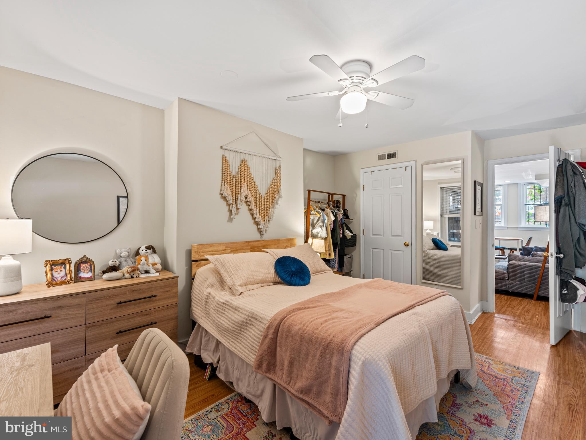 1414 Swann Street Northwest Washington, DC 20009 - Photo 31 of 38 a bedroom with a bed and a chandelier