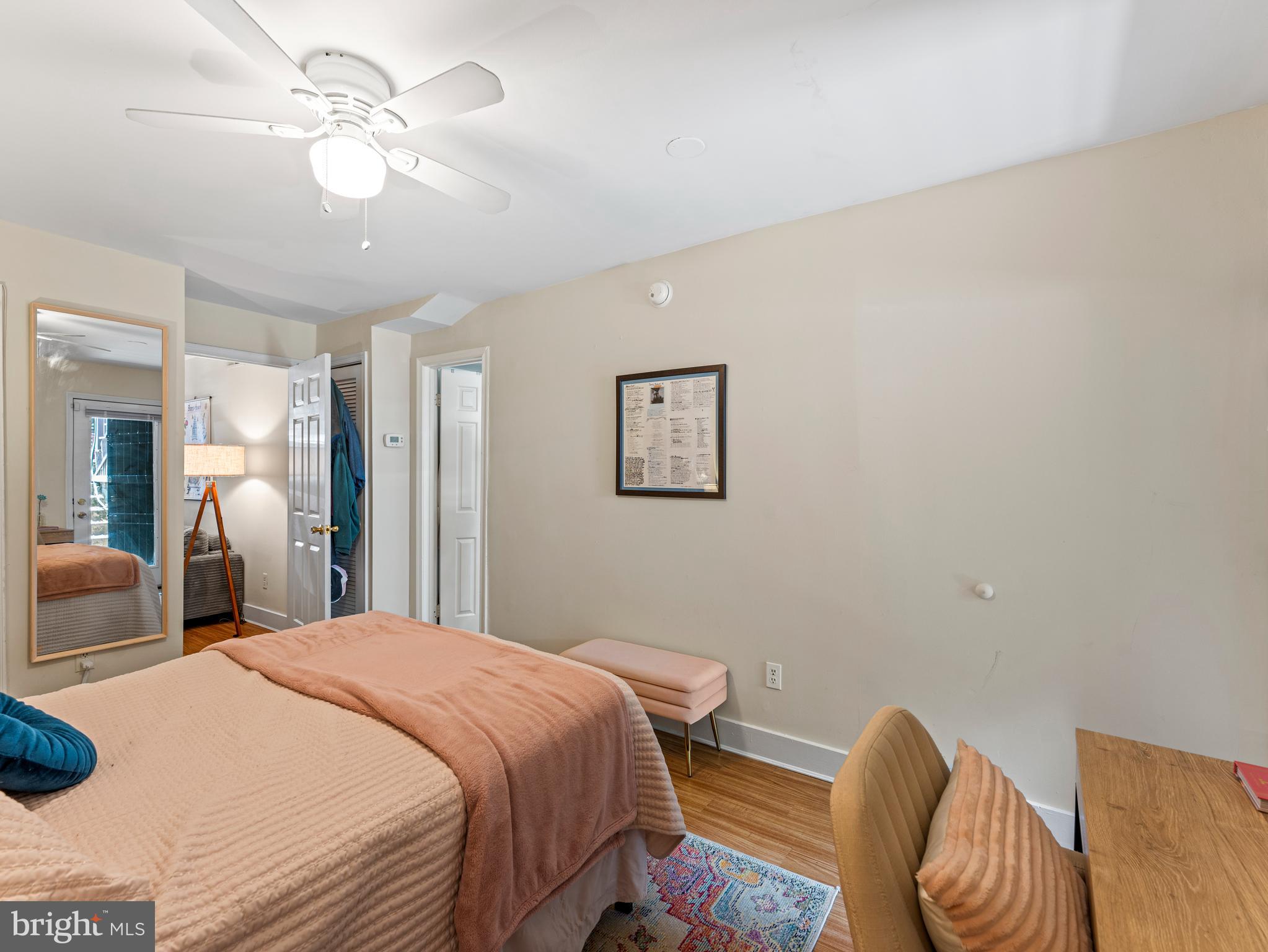 1414 Swann Street Northwest Washington, DC 20009 - Photo 32 of 38 a bedroom with a bed and a chandelier