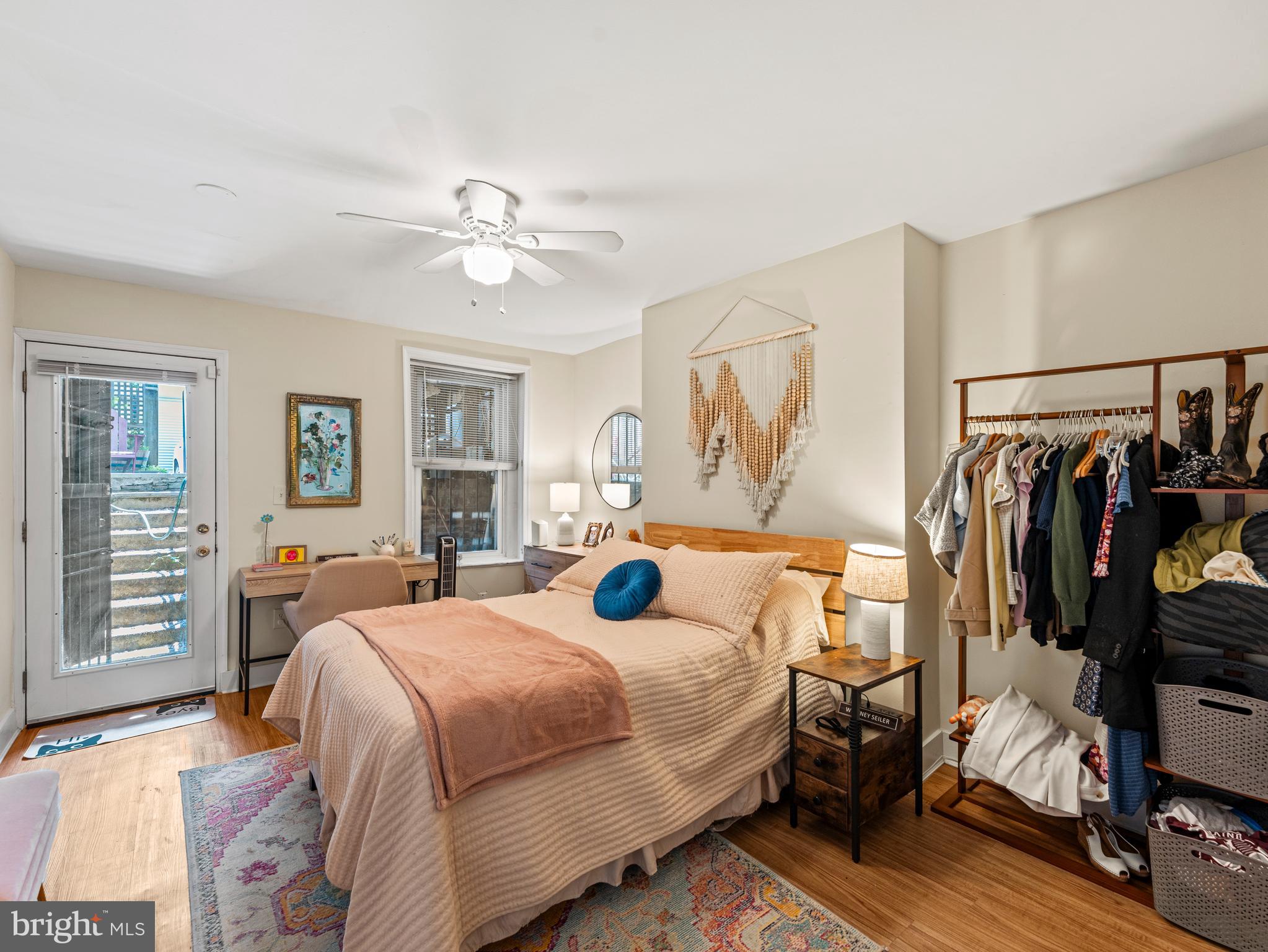 1414 Swann Street Northwest Washington, DC 20009 - Photo 33 of 38 a bedroom with a bed and wooden floor
