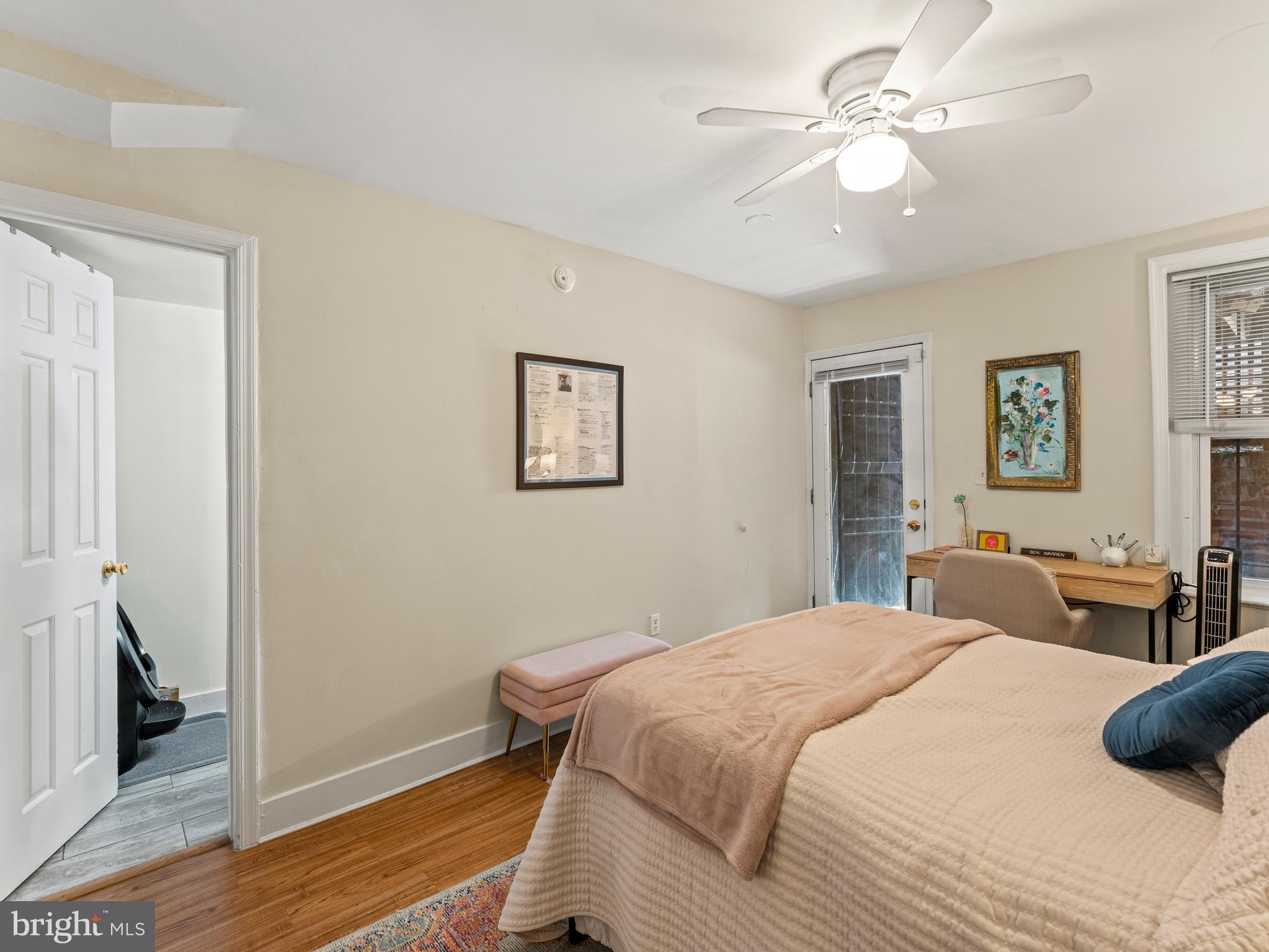 1414 Swann Street Northwest Washington, DC 20009 - Photo 34 of 38 a bedroom with a bed and wooden floor