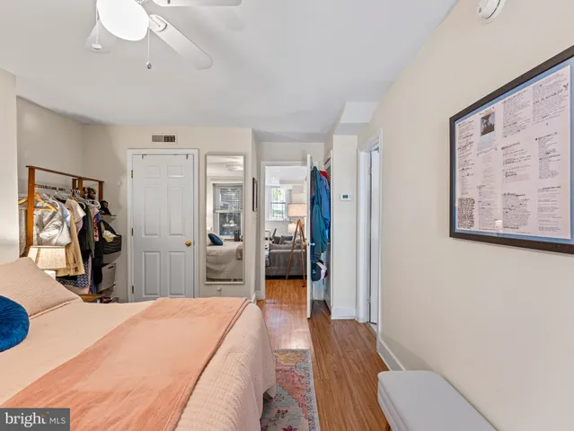 a bedroom with a bed and a walk in closet
