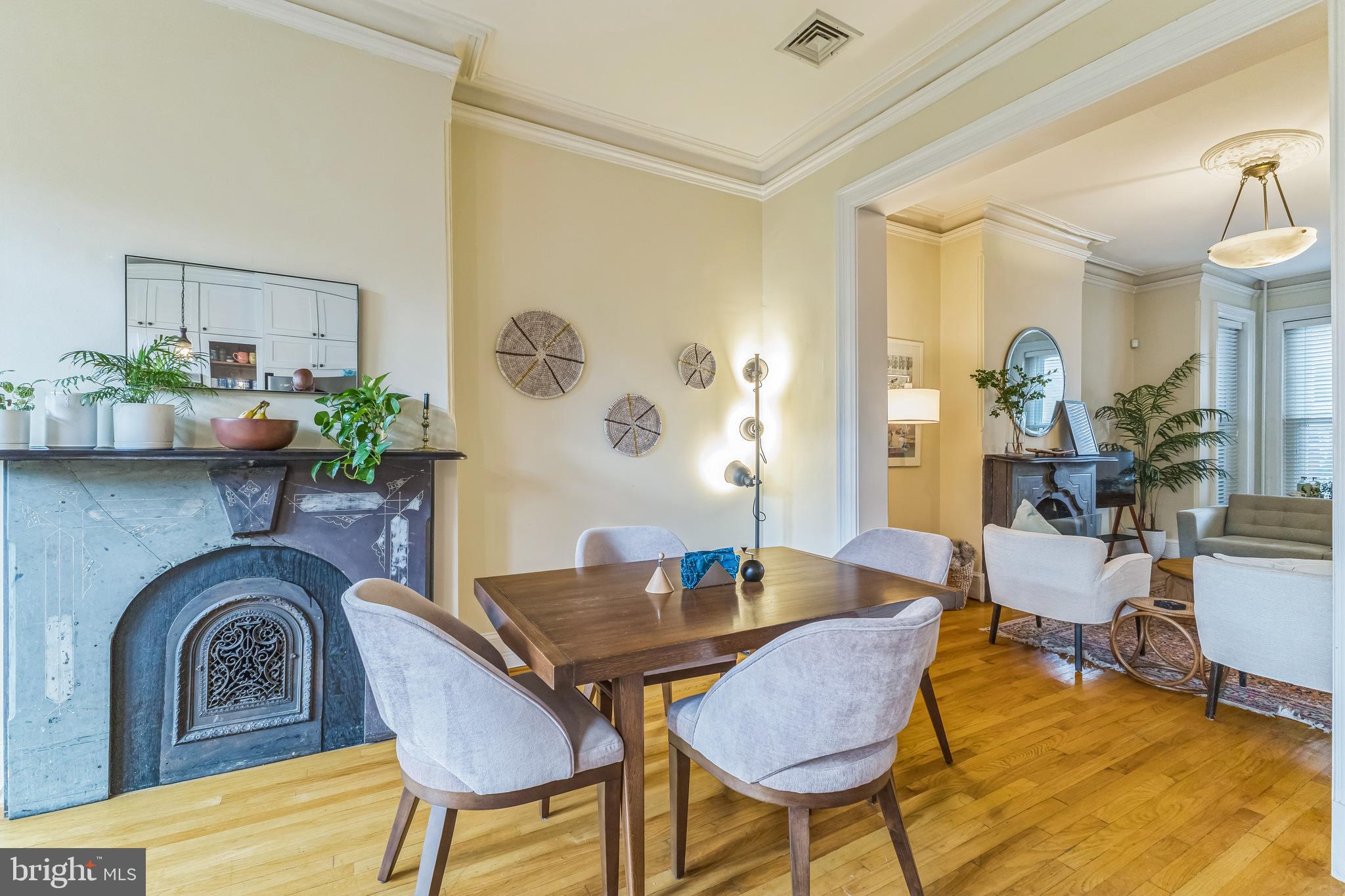 1414 Swann Street Northwest Washington, DC 20009 - Photo 8 of 38 a living room with furniture and a table