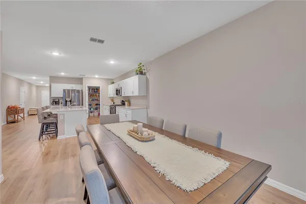 a large kitchen with stainless steel appliances granite countertop lots of counter space a sink and a stove