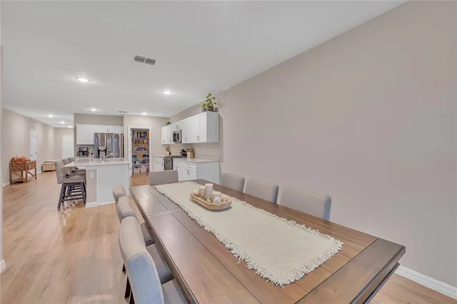 a large kitchen with stainless steel appliances granite countertop lots of counter space a sink and a stove