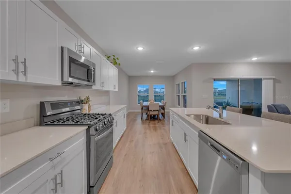 a bedroom with a bed dresser and a window