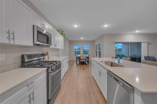 a bedroom with a bed dresser and a window