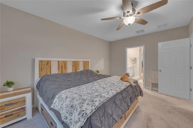 a en suite bathroom with double sink and a mirror
