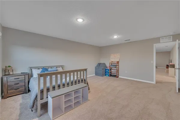 a bathroom with a double vanity sink toilet mirror and bathtub