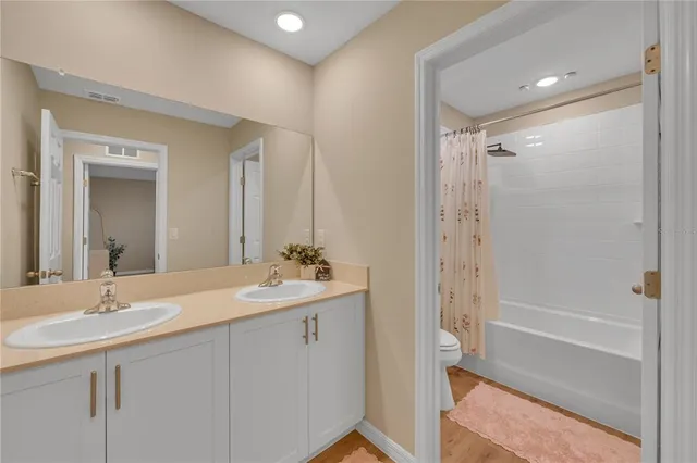 a bedroom with a bed and a cabinets