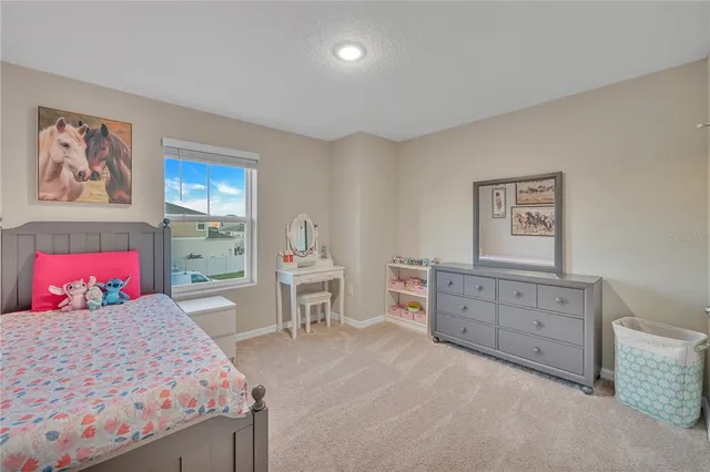 a bedroom with a bed and a table