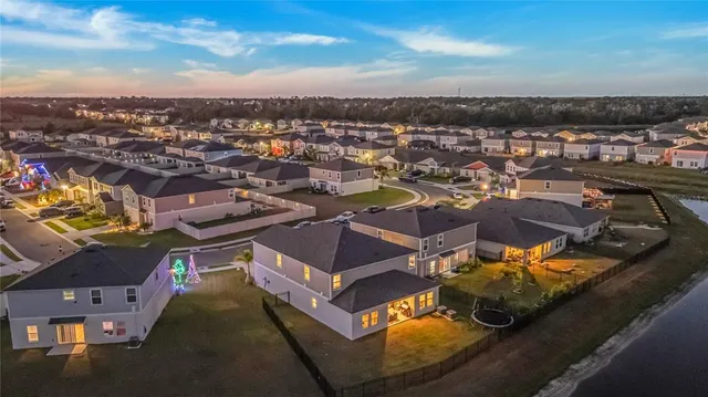 an aerial view of a house with a ocean view