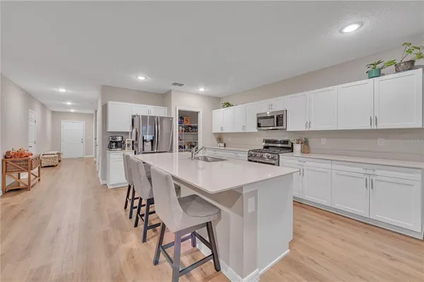 a kitchen with a table and chairs in it