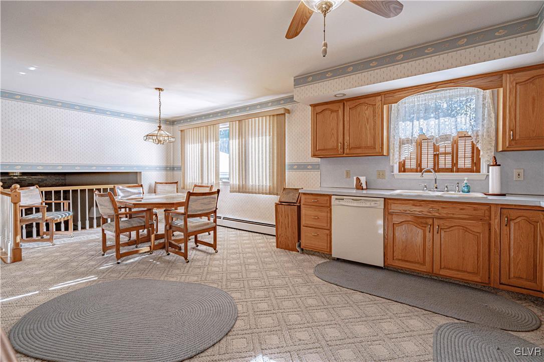 551 Birch Road Hazleton, PA 18202 - Photo 13 of 44 a kitchen with a table chairs sink and cabinets
