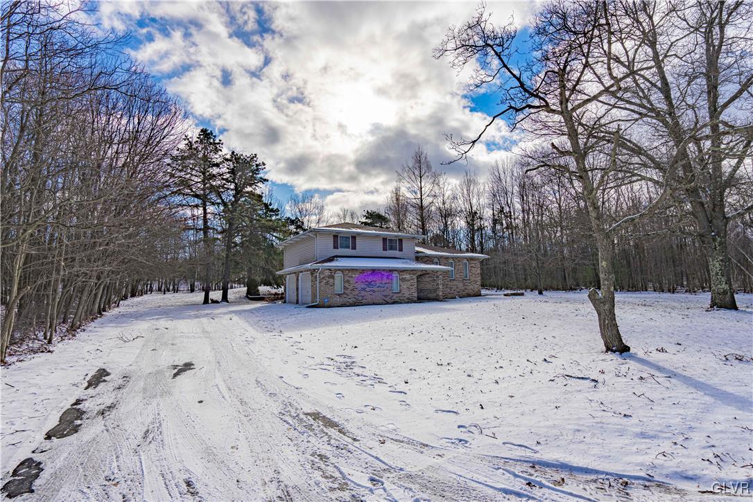 551 Birch Road Hazleton, PA 18202 - Photo 2 of 44 a street view covered with snow