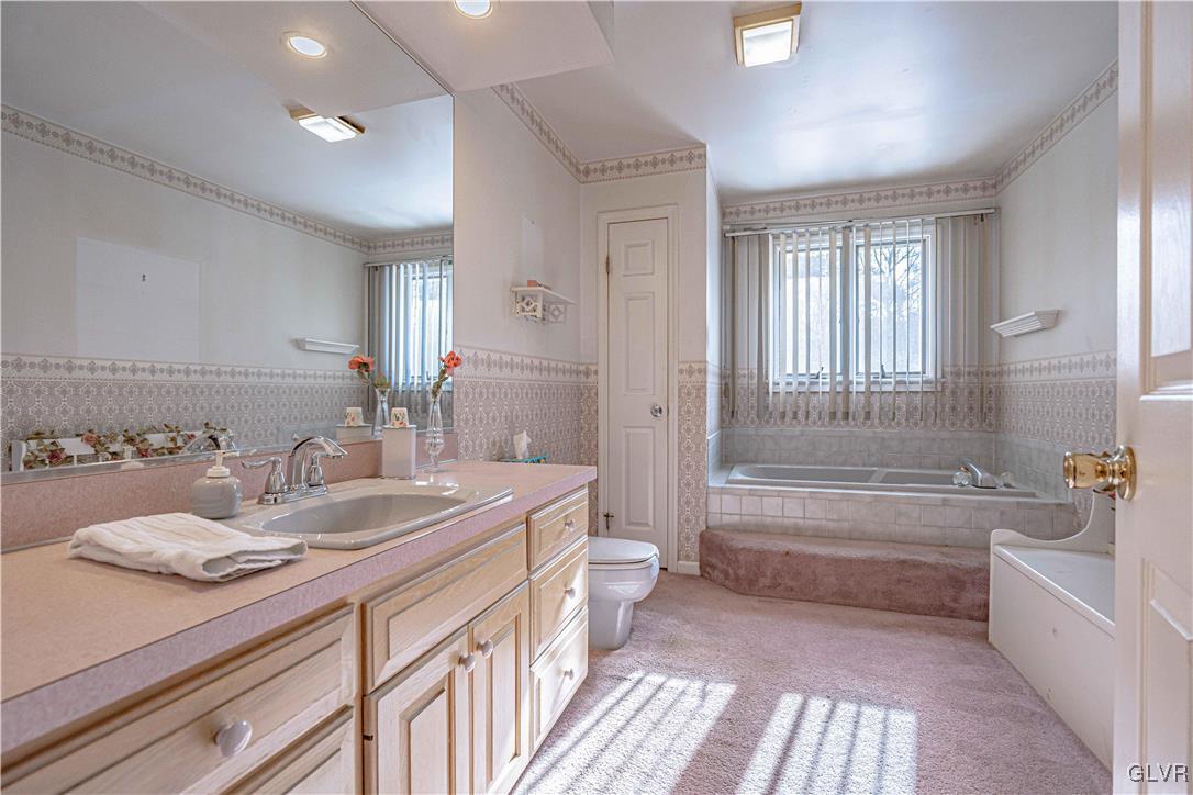 551 Birch Road Hazleton, PA 18202 - Photo 21 of 44 a bathroom with a granite countertop sink a toilet a bathtub and shower