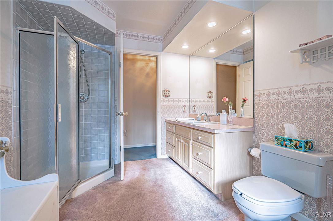 551 Birch Road Hazleton, PA 18202 - Photo 23 of 44 a bathroom with a double vanity sink toilet and shower