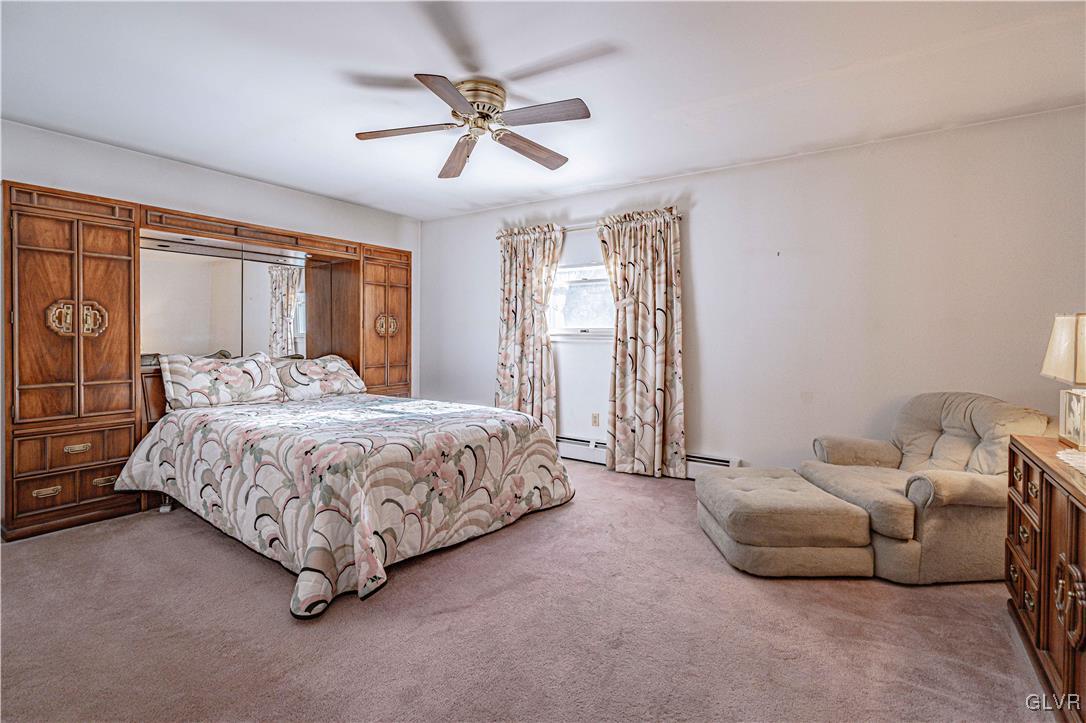 551 Birch Road Hazleton, PA 18202 - Photo 24 of 44 a spacious bedroom with a bed and a ceiling fan