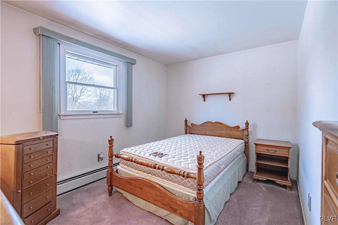 551 Birch Road Hazleton, PA 18202 - Photo 31 of 44 a bed sitting in a bedroom next to a window
