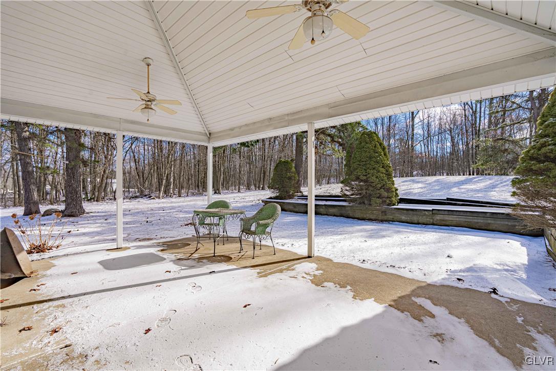 551 Birch Road Hazleton, PA 18202 - Photo 38 of 44 a view of a patio with a table and chairs under an umbrella