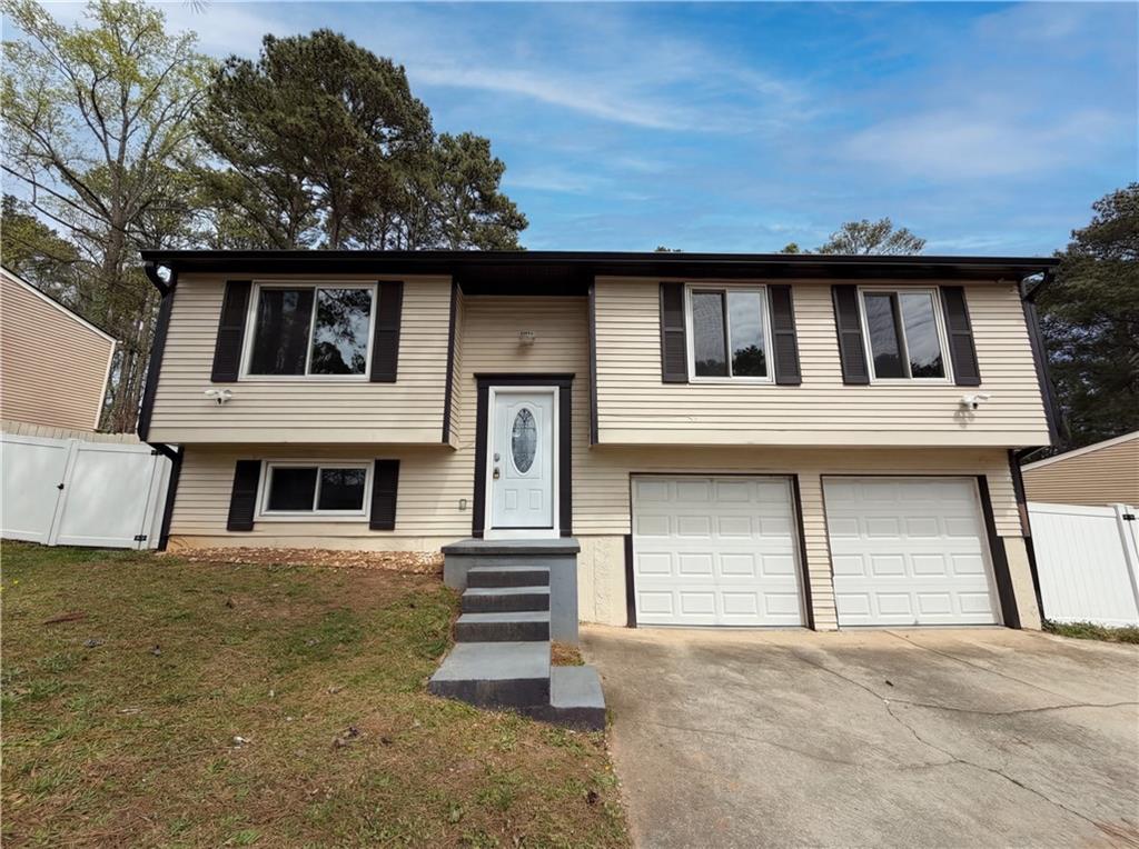 1258 Roman Point Drive Norcross, GA 30093 - Photo 1 of 1 a front view of a house with a garage