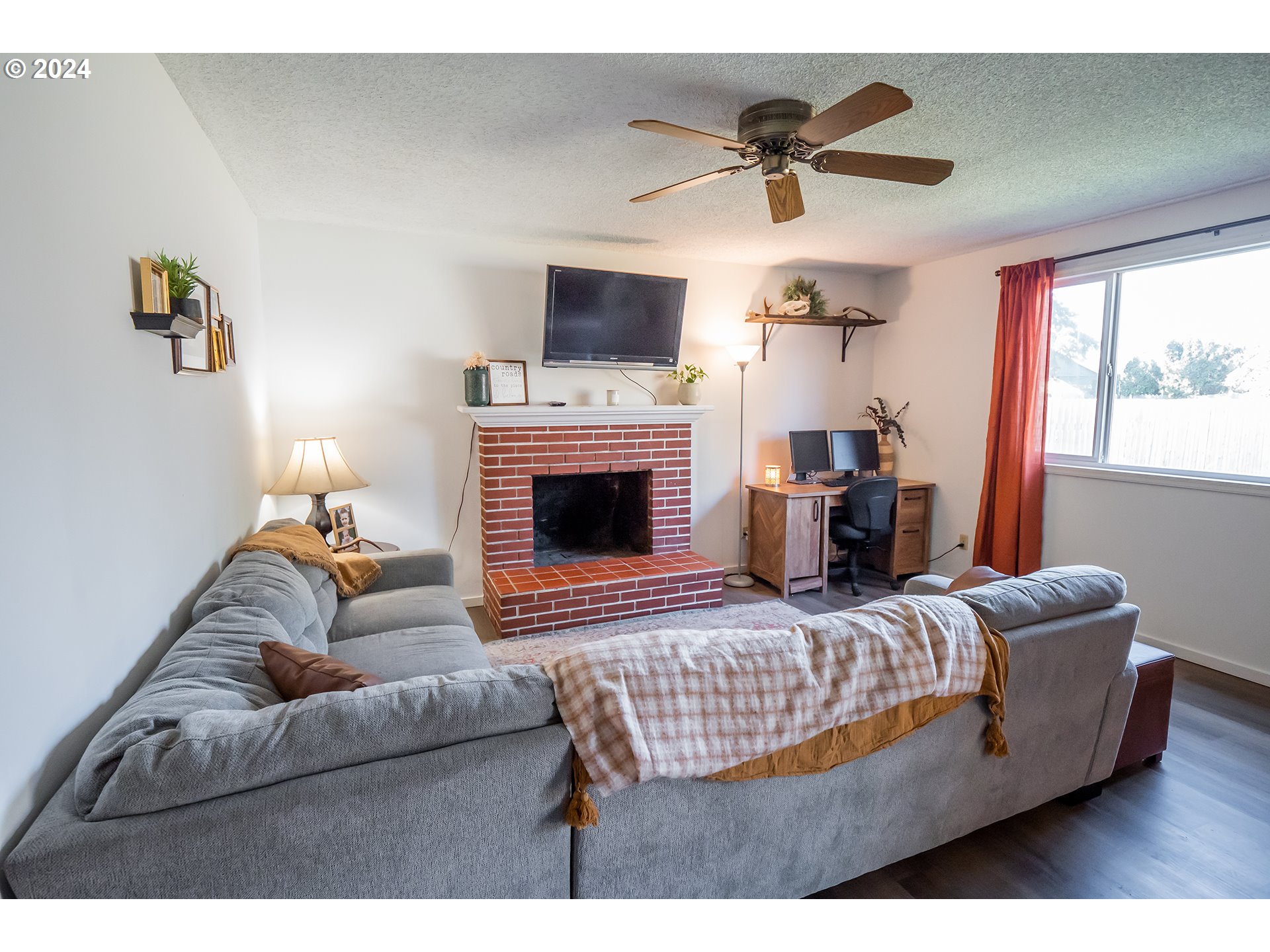 6852 A Street Springfield, OR 97478 - Photo 2 of 16 a living room with furniture fireplace and a window