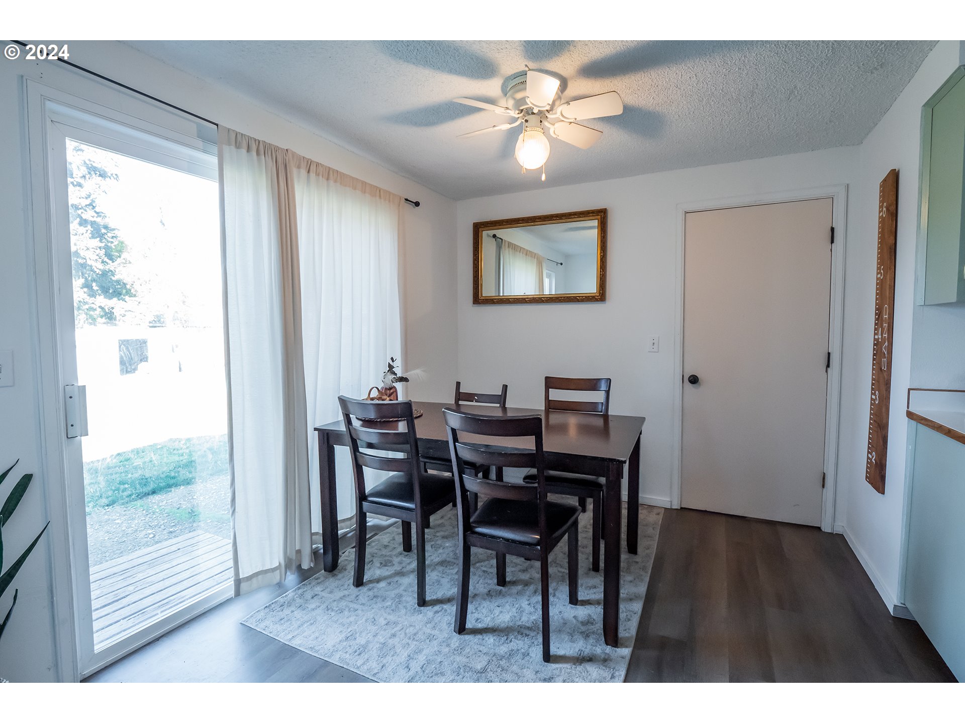 6852 A Street Springfield, OR 97478 - Photo 6 of 16 a view of a dining room with furniture window and wooden floor