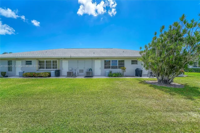 a view of a house with a garden