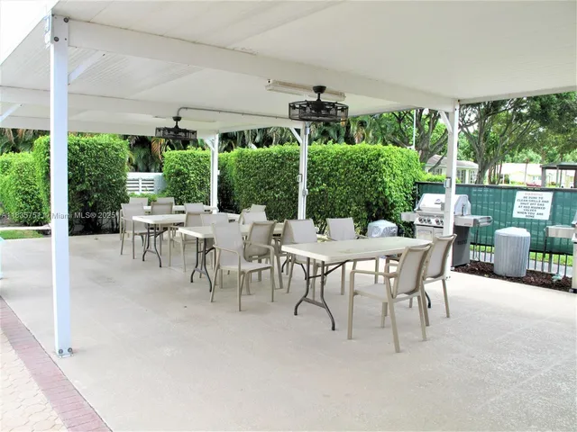 a bathroom with a toilet a sink and shower