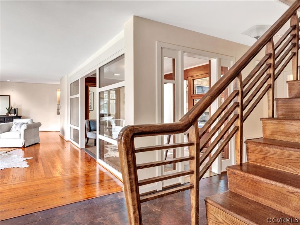 8010 Thom Road Henrico, VA 23229 - Photo 2 of 50 a view of staircase with lots of frames on wall and a large window